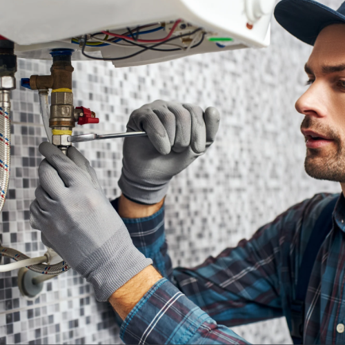 worker fixing the pipes